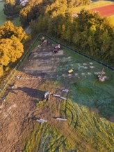 Construction site with machines and construction grids in a natural environment, Bau PV