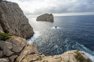 Steep cliffs by the sea and the rocky island of Isola Foradada, Belvedere Foradada, cliffs on the