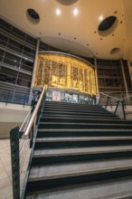 Festively illuminated staircase inside a Stern Center shopping center with Christmas decoration,