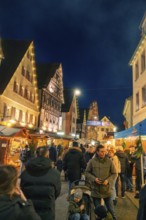 Evening Christmas market with illuminated half-timbered houses and festive atmosphere, Christmas