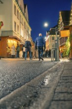 Christmas street at night with people and festive lighting, Christmas market 2025, Nagold, Black