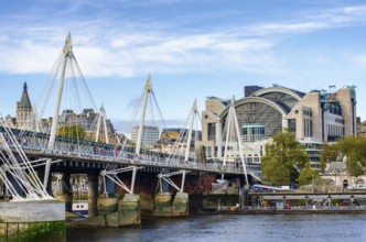 The Hungerford Bridge and Golden Jubilee Bridge across the Thames with Embankment Place, City of