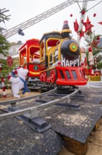 Close-up view of a cheerful toy locomotive at a Christmas market, Sindelfingen, Böblingen district,
