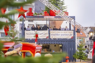 Stage with musicians and Christmas decorations at a festive Christmas market, Sindelfingen,
