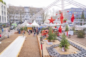 Christmas market with decorations and a toy train surrounded by visitors, Sindelfingen, Böblingen