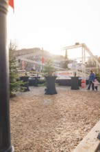 An urban marketplace with tables and people in a wintry atmosphere in sunlight, Sindelfingen,
