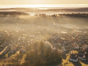 View of a village from above, rays of light and fog create an atmospheric atmosphere, Gechingen,
