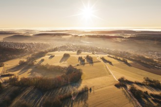 Aerial view of vast fields with bright sunshine and fog, Gechingen, Hecken and GÃ¤u region, Calw