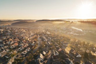 Sunrise over a village bathed in golden twilight shades, Gechingen, Hecken and GÃ¤u region, Calw