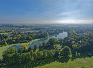 The sandback lake in Hamburg's Vier- und Marschlanden in autumn. aerial view. FÃ¼nfhausen,