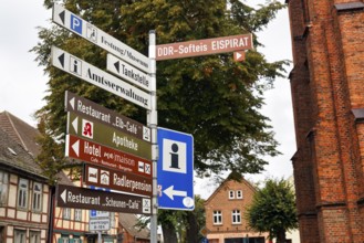 Various signs for tourists and cyclists on Elberadweg, tourist information, hotel, restaurant,