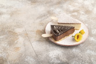 Chocolate and Vanilla Cake pops Marshmallow on brown concrete background. side view, copy space