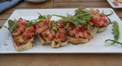 Bruschetta served in a garden café, Ahrenshoop, DarÃŸ, Mecklenburg-Vorpommern, Germany