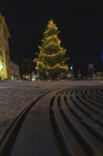 A Christmas tree shot from below with lights at night, Aidlingen, Böblingen district, Germany