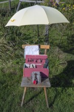 Jewellery offering under an umbrella by the wayside, Ahrenshoop, DarÃŸ, Mecklenburg-Western