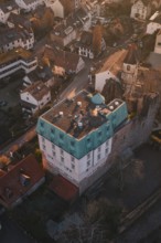 Old building with copper roof in a small village surrounded by autumn trees, Dillweisenstein,