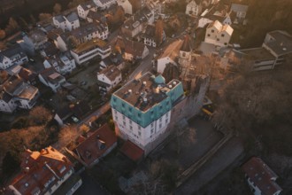 Castle overlooks a village in soft morning light, Dillweisenstein, Pforzheim, Germany