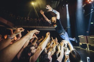 Billy Lunn, singer and guitarist from The Subways, crowd-surfing the fans live on For Eternity Tour