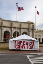 Washington, DC - A large sign outside Union Station calls for impeachment and conviction