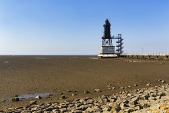 Historic lighthouse Obereversand im Wadden Sea, iron tower with black lantern, landmark,