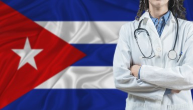Medical professional on Cuba flag. Healthcare and wellness in Cuba, Concept