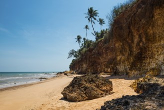Lonely beach with red rocks and coconut trees, Red Cliffs, Bang Saphan Noi, Prachuap Khiri Khan