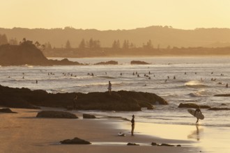 Fisherman Lookout, The Pass and surfers in the evening light of Byron Bay, New South Wales,