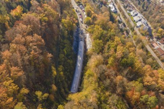 Bird's-eye view of a tunnel construction project integrated into an urban and autumnal forest