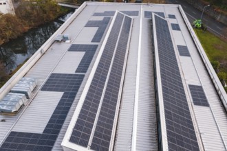Roof with solar panels on an industrial building in an urban environment, PV at Walther Lindner