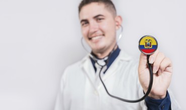 Doctor showing stethoscope with Ecuador flag. Ecuador national healthcare concept