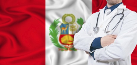 Peru healthcare concept. Male doctor on Peru flag. Doctor with crossed arms on Peru flag