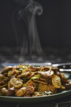 A colorful mix of mushrooms and vegetables is stir-fried to perfection, filling the air with
