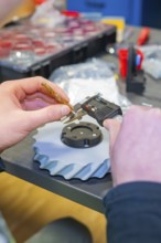 Person measuring component with caliper and drill, Jugend Forschungszentrum Nagold, Calw district,