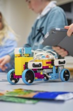 A colorful Lego robot is being assembled by children, Jugend Forschungszentrum Nagold, Calw
