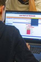 Young person looking at math problems on a laptop screen, Jugend Forschungszentrum Nagold, Calw
