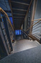 Stairs with industrial design in blue light at night, Amazonia exhibition, Gasometer, Pforzheim,