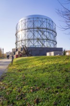 Large steel building in front of a sunny green area, Amazonia exhibition, Gasometer, Pforzheim,