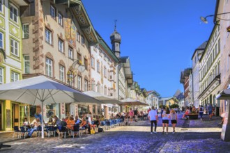 Historic market street with street cafe and typical gabled houses, Bad Tölz. Isartal, Upper