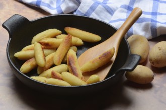 Fried puff noodles in a pan