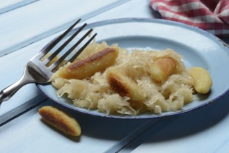 Fried puff noodles with sauerkraut on plate
