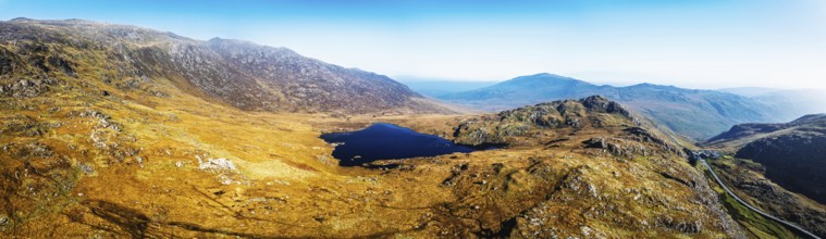 Autumn colours over Llyn Cwmffynnon and Miner's Track, Start Point, road A4086 from a drone,