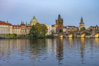 Old Town of Prague with Vltava River, Charles Bridge and Old Town Bridge Tower at dusk, Prague,
