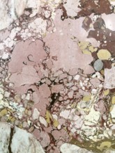 Pink and brown marble surface with natural patterns