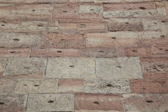 Textured brick wall in shades of red and brown with retro style