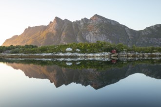 Sunset over FestvÃ¥g near BodÃ¸. Reflection of mountains in the fjord