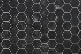 A black surface featuring a hexagonal pattern, highlighting a textured look. This design offers a