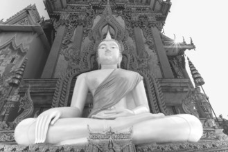 Buddha statue with tunic, Bhumispara mudra, Buddha Gautama at the moment of enlightenment, at the