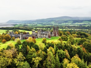 Autumn colours over Penrhyn Castle and Garden from a drone, Llandygai, Bangor, Gwynedd, North