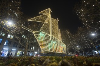 The KurfÃ¼rstendamm in western Berlin with Christmas lights and several light installations, such