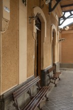 Soller train station, outer waiting area with 2 wooden benches, Majorca, Spain